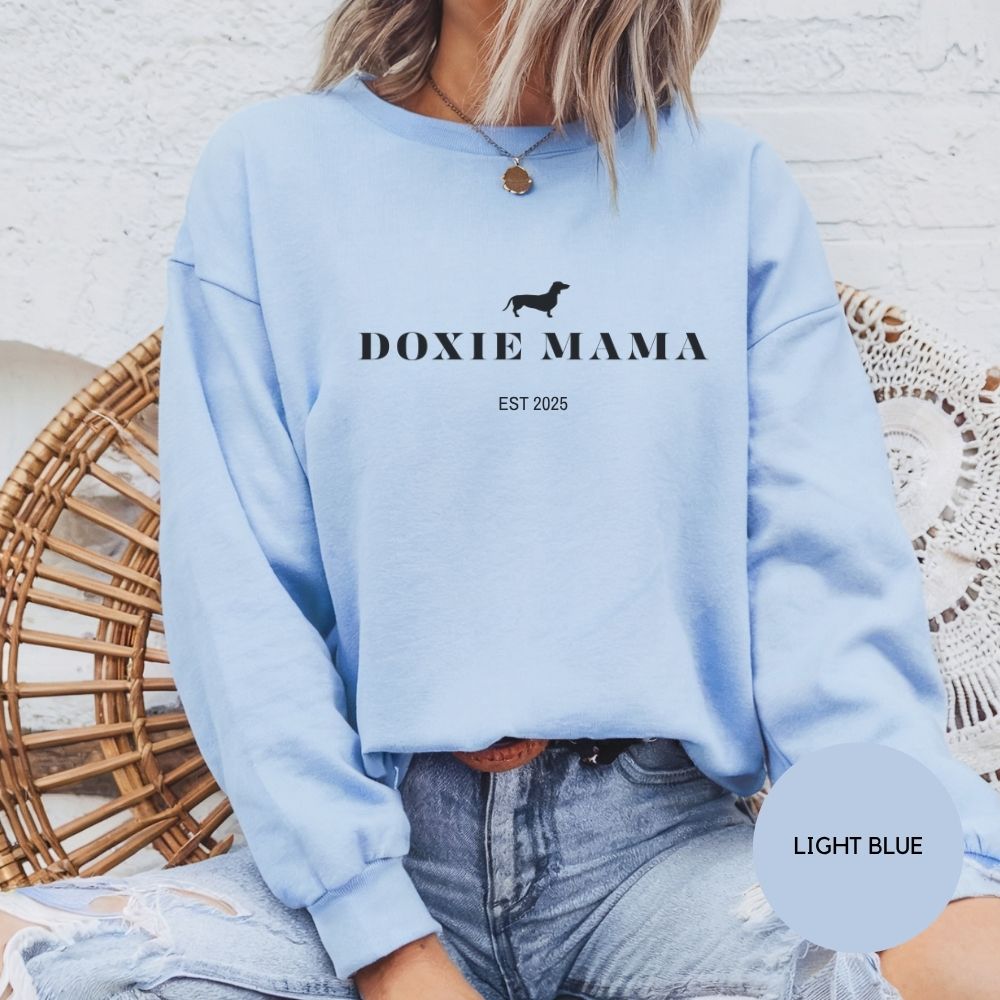 Light blue Doxie Mama sweatshirt with dachshund silhouette, cozy and casual dog mom fashion